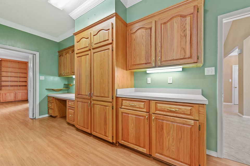 plenty of cabinets and work desk area!