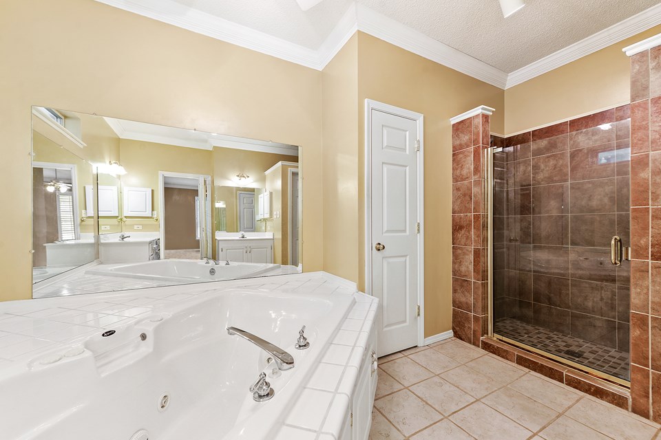 master bath soak tub with tile shower.